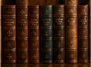 Leather bound books on a shelf